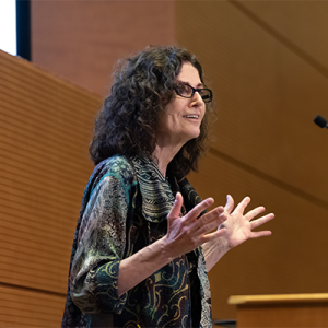 Titia de Lange, PhD at a podium